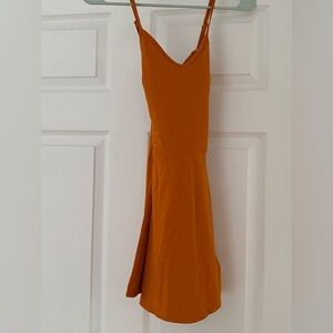 JoyLab Copper Yellow Women’s tennis dress, with built in bra and shorts